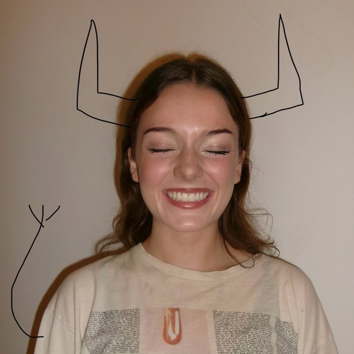 Lillian Sullivan smiling, with hand-drawn bull horns and a tail
